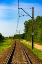 Vertical shot of an empty train railway on a sunny day Royalty Free Stock Photo