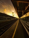 Vertical shot of the empty train station in the morning Royalty Free Stock Photo