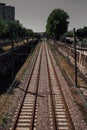 Vertical shot of empty train tracks on a sunny day Royalty Free Stock Photo