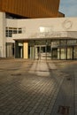 Vertical shot of the entrance of the Berlin Philharmonic Hall in the golden sunshine