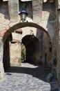 Vertical shot of the entrance to the Medieval Fort located in Sighisoara, Romania Royalty Free Stock Photo