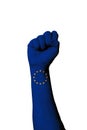 Vertical shot of the european union flag painted on human raised fist Royalty Free Stock Photo