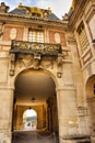 Vertical shot of the exterior facade of the historic Palace of Versailles in France