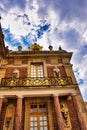 Vertical shot of the exterior facade of the historic Palace of Versailles in France