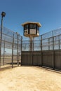 Vertical shot of Exterior Prison Yard Empty with guard tower Royalty Free Stock Photo