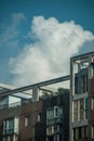 Vertical shot of a facade of a building under the sky with clouds in Meishan, Sichuan, China