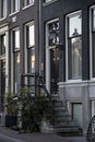 Vertical shot of the facade of typical historic Dutch canal homes in Amsterdam