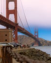 Vertical shot of the famous Golden Gate Bridge with visitors in San Francisco, United States