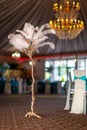 Vertical shot of a feather tree centerpiece on the floor of a ballroom Royalty Free Stock Photo