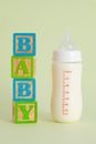 Vertical shot of a feeding bottle and \