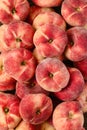 Vertical shot of flat peaches in a pile Royalty Free Stock Photo