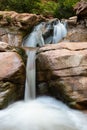 Vertical shot of the flowing Kanarra Falls in Kanarraville, Utah