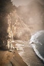 Vertical shot of foggy McWay Falls waterfall on the coast of Big Sur in central California Royalty Free Stock Photo