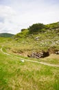 Vertical shot of a footpath in the middle of beautiful Austrian Hills Royalty Free Stock Photo