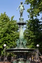 Vertical shot of a fountain with a female statue in Brunnsparken park in Gothenburg, Sweden