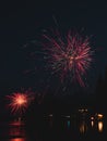 Vertical shot of Fourth of July fireworks in a night sky over Washington Lake Royalty Free Stock Photo