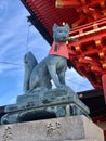 Vertical shot of a fox statue in the Fushimi Inari Shrine Japan Royalty Free Stock Photo