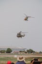 Vertical shot of French combat helicopters in a gloomy gray sky during an air show in Pretoria