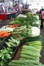 Vertical shot of fresh vegetables and herbs on a market shelf Royalty Free Stock Photo