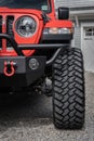 Vertical shot of a freshly cleaned jeep sitting in a driveway
