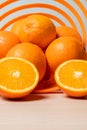 Vertical shot of freshly sliced oranges on a spiral bowl Royalty Free Stock Photo