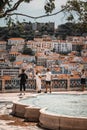 Vertical shot of friends enjoying the view of Lisbon