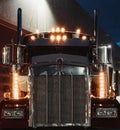 Vertical shot of the front of a truck at night