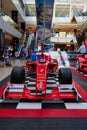 Vertical shot at front of a vintage Ferrari F1 Championship car inside of Maremagnum Shopping mall Royalty Free Stock Photo