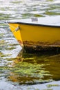 Vertical shot of the front yellow detail of a boat on the water Royalty Free Stock Photo