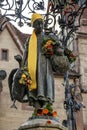 Vertical shot of the Gaenseliesel or Goose Girl fountain at Goettingen square in Germany