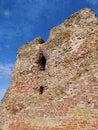 Vertical shot of the gammel Slot in Denmark against a blue sky