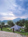 Vertical shot of a gazebo with a lake surrounded by woodlands in the background in the FRIM Kepong Royalty Free Stock Photo