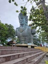 Vertical shot of a giant statue of Vishnu in the Garuda Wisnu Kencana Cultural Park in Bali.