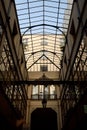 Vertical shot of the glass roof in Parisian shopping gallery, France