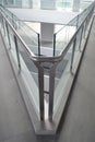 Vertical shot of glass surfaces forming a sharp angle in a modern building Royalty Free Stock Photo