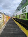 Vertical shot of a GO train passing by a station under construction in Toronto, Canada Royalty Free Stock Photo