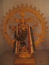 Vertical shot of a golden Hindu statue