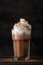 Vertical shot of a gourmet iced coffee with whipping cream on a black background Royalty Free Stock Photo