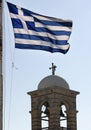 Vertical shot of the Greek flag in Lycabettus hill in Athens, Greece Royalty Free Stock Photo