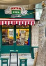 Vertical shot of green tables and chairs in front of Weibdeh Central Perk Cafe in Amman, Jordan