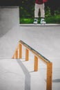 Vertical shot of grind rail at a skatepark in white background, Sweden