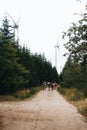 Vertical shot of a group of campers walking in a rural area