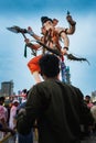 Vertical shot of a guy in front of Ganesha on the Ganpati Visarjan, Girgaon Chowpatty, Mumbai, India