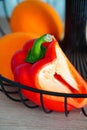 Vertical shot of a half-cut red organic healthy pepper