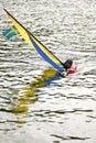 Vertical shot of a half drown windsurfing boat with the flag of Sweden Royalty Free Stock Photo