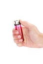 Vertical shot of a hand holding a pink lighter isolated on a white background Royalty Free Stock Photo