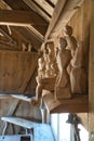 Vertical shot of the handmade wooden figures in the workshop