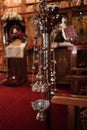 Vertical shot of hanging icon-lamps in orthodox church