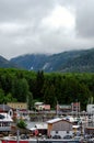 Vertical Shot Of The Harbor With Town Buildings Against The Background Of Green Trees. Ketchikan.