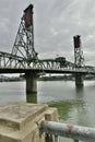 Vertical shot of the Hawthorne Bridge over the Willamette River, located in Portland on a cloudy day Royalty Free Stock Photo